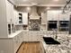 Gourmet kitchen with granite countertops, stainless steel appliances, and custom cabinetry at 7106 Royal Oakland Dr, Indianapolis, IN 46236