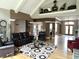 Open and inviting living space with hardwood floors, high ceilings and an open view to the entryway at 7106 Royal Oakland Dr, Indianapolis, IN 46236