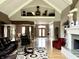 Bright, open floor plan boasts high ceilings, hardwood floors, a fireplace, and access to the main entry at 7106 Royal Oakland Dr, Indianapolis, IN 46236