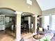 Open-concept living area flowing into the kitchen, with light-filled windows and stylish architectural details throughout at 7106 Royal Oakland Dr, Indianapolis, IN 46236