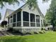 Charming screened in porch overlooking the manicured backyard and garden at 7106 Royal Oakland Dr, Indianapolis, IN 46236