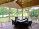 Relaxing screened-in porch with wood ceiling, overlooking a lush backyard, perfect for outdoor entertaining at 7106 Royal Oakland Dr, Indianapolis, IN 46236