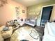 Bright Bedroom with themed decor, laminate floors, and natural light at 729 Maple Ln, Brownsburg, IN 46112
