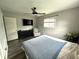 Bedroom features laminate flooring, neutral walls, and ceiling fan at 729 Maple Ln, Brownsburg, IN 46112