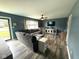 Comfortable living room with modern flooring, ceiling fan and large sectional sofa at 729 Maple Ln, Brownsburg, IN 46112