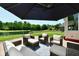 Cozy patio with comfortable seating and a lake view, perfect for relaxation and outdoor gatherings at 7413 Misty Woods Ln, Indianapolis, IN 46237