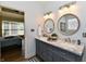 This beautiful double vanity is in the primary bathroom with luxury finishes and hardware at 7413 Misty Woods Ln, Indianapolis, IN 46237