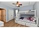 Stylish bedroom featuring a unique bunk bed with built-in stairs and storage, perfect for  at 7413 Misty Woods Ln, Indianapolis, IN 46237