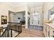 Inviting foyer with hardwood floors and a view into the formal dining room at 7413 Misty Woods Ln, Indianapolis, IN 46237