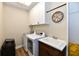 Laundry room with white washer and dryer, sink, and ample storage space at 7413 Misty Woods Ln, Indianapolis, IN 46237