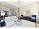 Open-concept living room featuring a modern fireplace and plush seating area at 7413 Misty Woods Ln, Indianapolis, IN 46237
