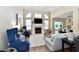 Spacious living room with a fireplace, large windows, and comfortable seating at 7413 Misty Woods Ln, Indianapolis, IN 46237