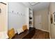 Mudroom with built-in bench, storage, and hooks, perfect for organization at 7413 Misty Woods Ln, Indianapolis, IN 46237