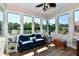 This sun room has large windows, luxury vinyl floors and lots of natural light at 7413 Misty Woods Ln, Indianapolis, IN 46237