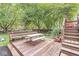 A cozy wood deck features seating and a view of the fenced yard at 7616 E Concord Ln, Fishers, IN 46038