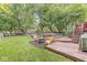 Enjoy the outdoors in this expansive backyard with a deck, lush lawn, and mature trees, great for entertaining at 7616 E Concord Ln, Fishers, IN 46038