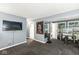Finished basement with entertainment and exercise areas, features a unique flooring pattern and ample lighting at 7616 E Concord Ln, Fishers, IN 46038
