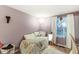 This bedroom features hardwood floors and a window offering natural light at 7616 E Concord Ln, Fishers, IN 46038