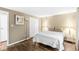 This bedroom features hardwood floors, neutral walls, and a comfortable bed at 7616 E Concord Ln, Fishers, IN 46038