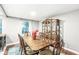 Traditional dining room with hardwood floors, china cabinet, and bright natural light at 7616 E Concord Ln, Fishers, IN 46038