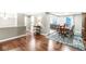 Open-concept dining room with hardwood floors and neutral walls at 7616 E Concord Ln, Fishers, IN 46038