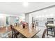 This dining room leads into the kitchen featuring bright cabinets at 7616 E Concord Ln, Fishers, IN 46038