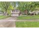 Charming two-story home featuring brick and siding, complemented by a well-manicured lawn and inviting curb appeal at 7616 E Concord Ln, Fishers, IN 46038