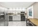 This kitchen features modern appliances and bright cabinets at 7616 E Concord Ln, Fishers, IN 46038