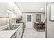 This kitchen features modern appliances, bright cabinets, and a breakfast bar at 7616 E Concord Ln, Fishers, IN 46038