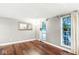 Living room featuring hardwood floors, neutral walls, and natural light at 7616 E Concord Ln, Fishers, IN 46038
