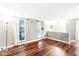 Spacious living room with hardwood floors, neutral walls, and lots of natural light at 7616 E Concord Ln, Fishers, IN 46038