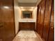 Bathroom features a single sink vanity and wood accents at 7721 Hollybrook Ln, Indianapolis, IN 46227