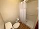 Bathroom featuring a toilet and walk-in shower at 7721 Hollybrook Ln, Indianapolis, IN 46227