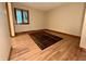 Cozy bedroom with a large window and wood flooring at 7721 Hollybrook Ln, Indianapolis, IN 46227