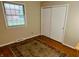 Bedroom with closet and natural light at 7721 Hollybrook Ln, Indianapolis, IN 46227