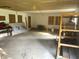 Large garage offering lots of open space for vehicles and other items, and shelving for storage at 7721 Hollybrook Ln, Indianapolis, IN 46227