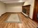 Cozy living room with hardwood floors and a brick fireplace at 7721 Hollybrook Ln, Indianapolis, IN 46227