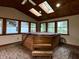 The sunroom includes a hot tub, brick floors, wood paneling, and several windows at 7721 Hollybrook Ln, Indianapolis, IN 46227
