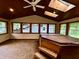 The sunroom features a hot tub and sliding glass doors leading to the backyard at 7721 Hollybrook Ln, Indianapolis, IN 46227