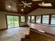 The sunroom includes a hot tub and sliding glass doors leading to the backyard at 7721 Hollybrook Ln, Indianapolis, IN 46227