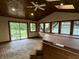 The sunroom features a hot tub and sliding glass doors leading to the backyard at 7721 Hollybrook Ln, Indianapolis, IN 46227