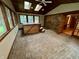 The sunroom features a hot tub and sliding glass doors leading to the backyard at 7721 Hollybrook Ln, Indianapolis, IN 46227