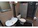 Stylish bathroom with a modern vanity and updated shower with gray stone-look at 828 N Butler Ave, Indianapolis, IN 46219
