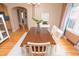 Charming dining room featuring hardwood floors, stylish decor, and natural light creating an inviting space at 828 N Butler Ave, Indianapolis, IN 46219