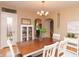 A dining room featuring wood table, white chairs, and a stylish chandelier at 828 N Butler Ave, Indianapolis, IN 46219