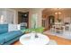 Bright dining room with hardwood floors, a classic dining table, and natural light at 828 N Butler Ave, Indianapolis, IN 46219