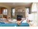 Inviting living room with a stone fireplace, hardwood floors, and natural light at 828 N Butler Ave, Indianapolis, IN 46219