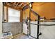Exposed basement with wood paneling, concrete walls, and visible utilities at 8920 Caminito Rd, Indianapolis, IN 46234