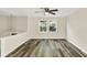 Bedroom with new luxury vinyl plank flooring and ceiling fan at 8920 Caminito Rd, Indianapolis, IN 46234