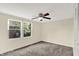 Spacious bedroom with ceiling fan and large windows providing ample natural light at 8920 Caminito Rd, Indianapolis, IN 46234